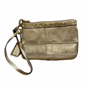 Coach tradition pattern gold tone wristlet